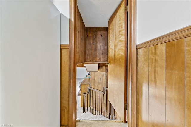 interior space featuring wood walls and tile patterned flooring