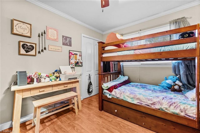 bedroom featuring ceiling fan, light wood-type flooring, and ornamental molding