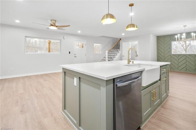 kitchen with recessed lighting, stainless steel dishwasher, a kitchen island with sink, a sink, and light wood-type flooring