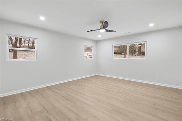 unfurnished room featuring recessed lighting, ceiling fan, light wood finished floors, and baseboards