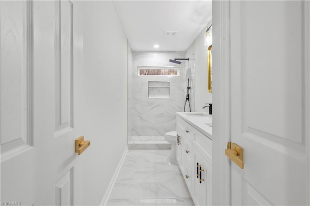 full bathroom with toilet, vanity, baseboards, marble finish floor, and a marble finish shower