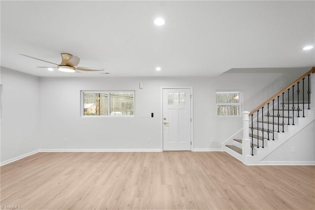 entrance foyer with recessed lighting, a ceiling fan, baseboards, stairway, and light wood finished floors