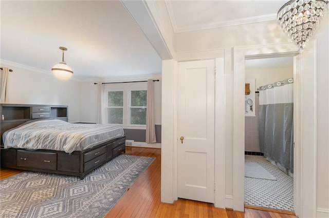 bedroom featuring crown molding and wood-type flooring