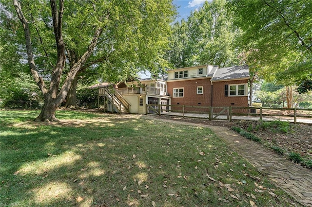 view of yard with a wooden deck