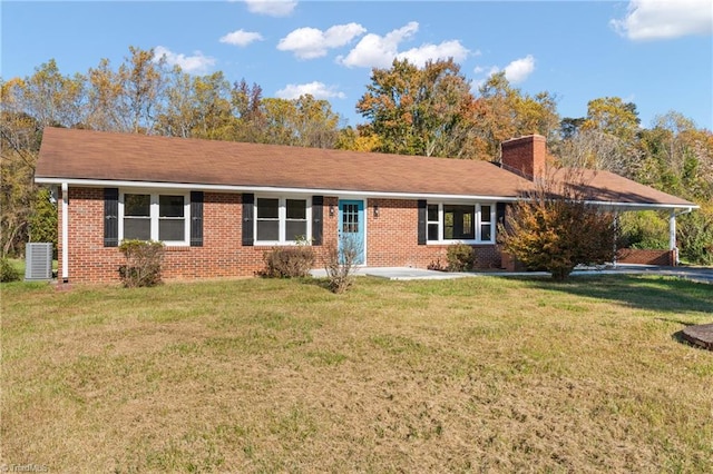 ranch-style home with central AC unit and a front lawn