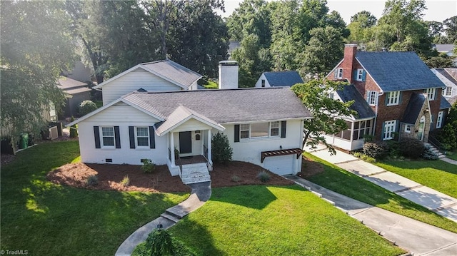 view of front of house featuring a garage and a front yard