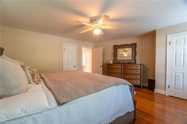 bedroom with dark wood-type flooring and ceiling fan