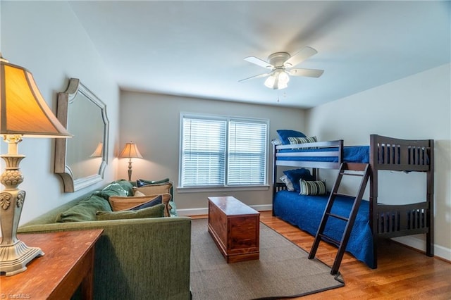 bedroom with hardwood / wood-style floors and ceiling fan