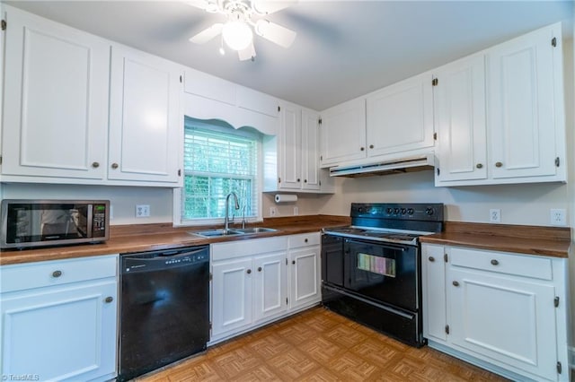 kitchen featuring white cabinetry, butcher block counters, sink, light parquet floors, and black appliances