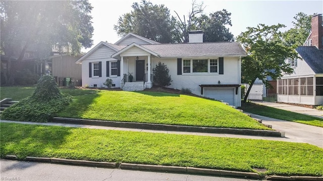 view of front of home with a garage and a front yard