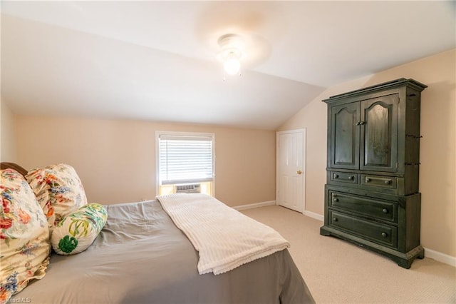 carpeted bedroom with lofted ceiling and cooling unit