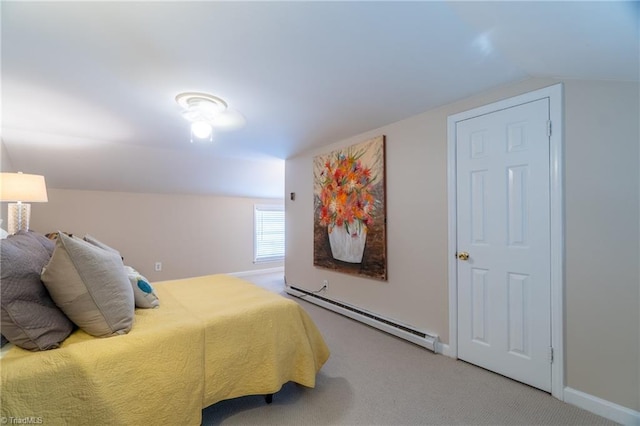 bedroom with a baseboard radiator, carpet flooring, and vaulted ceiling