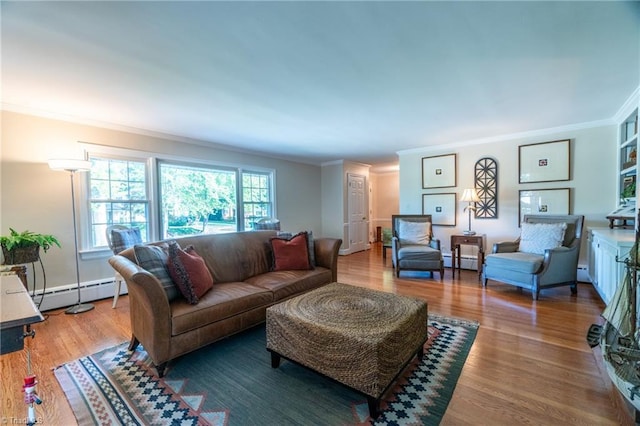 living room featuring a baseboard heating unit, ornamental molding, and hardwood / wood-style floors