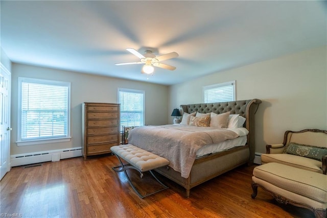 bedroom featuring a baseboard radiator, ceiling fan, and dark hardwood / wood-style flooring