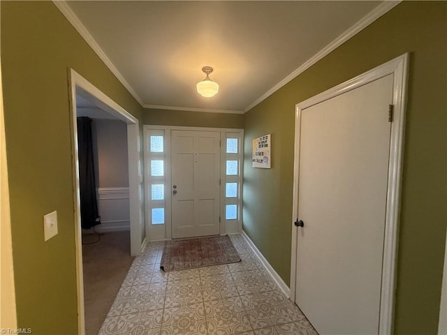 foyer with light tile patterned floors, ornamental molding, and a healthy amount of sunlight