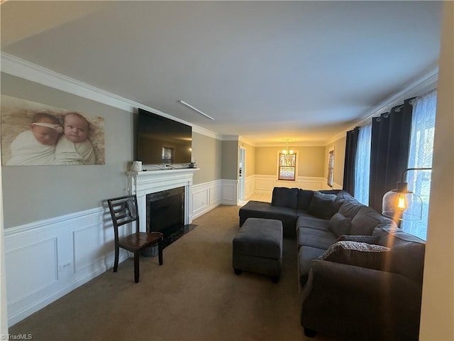 living room with ornamental molding and carpet