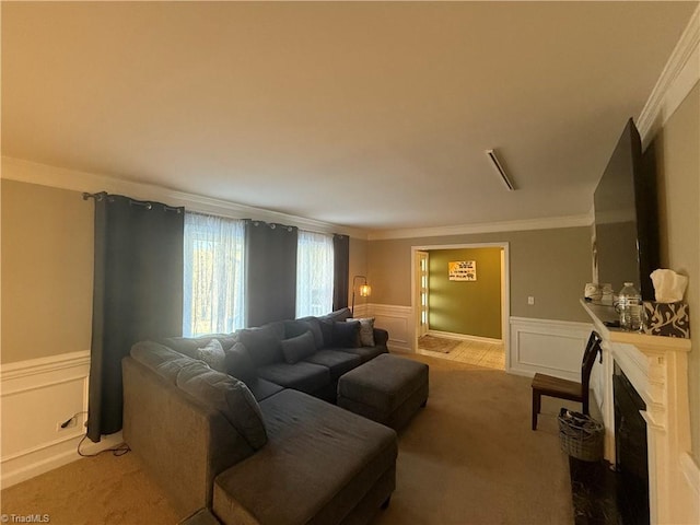 living room featuring ornamental molding and carpet flooring