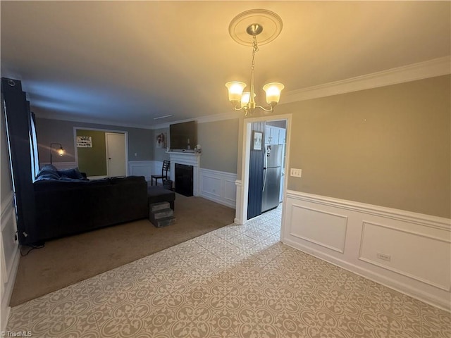 living room with ornamental molding and a notable chandelier