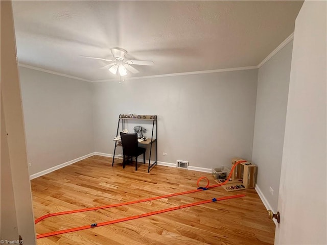 office featuring ornamental molding, ceiling fan, and hardwood / wood-style floors