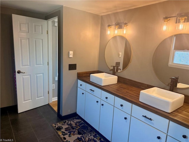 bathroom featuring tile patterned flooring and vanity