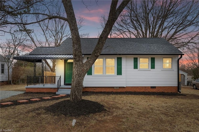 view of front of home with a porch and a yard