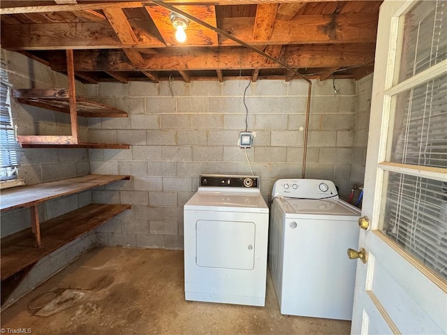 clothes washing area with washing machine and clothes dryer