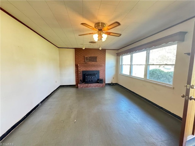 unfurnished living room featuring ceiling fan and a wood stove