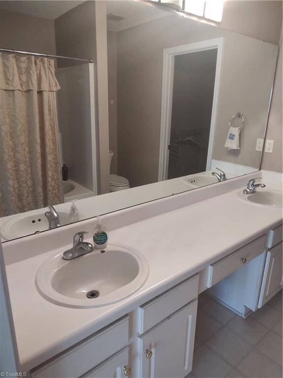 3855 Windstream Way, Jamestown, NC 27282 - full bath with vanity, toilet, tile patterned flooring, and shower / bath combo with shower curtain
