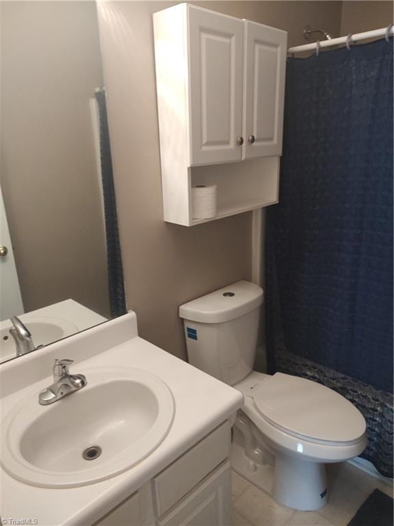 3855 Windstream Way, Jamestown, NC 27282 - full bathroom with a shower with shower curtain, vanity, tile patterned floors, and toilet