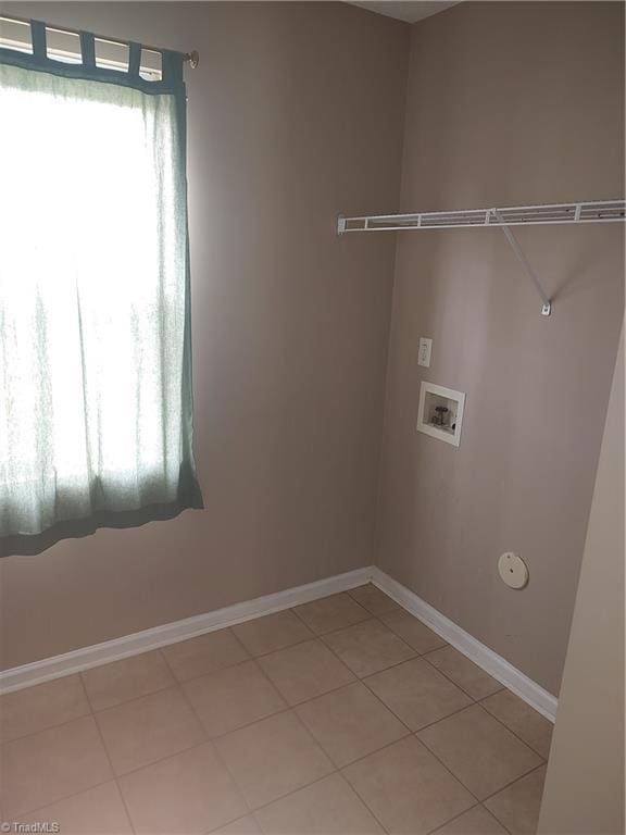 3855 Windstream Way, Jamestown, NC 27282 - washroom with washer hookup, baseboards, and light tile patterned flooring