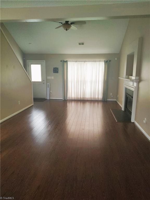 3855 Windstream Way, Jamestown, NC 27282 - unfurnished living room featuring a ceiling fan, a fireplace with flush hearth, dark wood-style floors, baseboards, and lofted ceiling