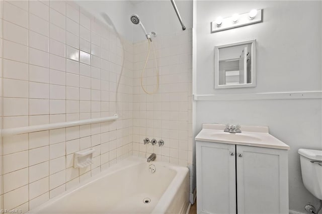 full bath featuring shower / bathing tub combination, toilet, and vanity