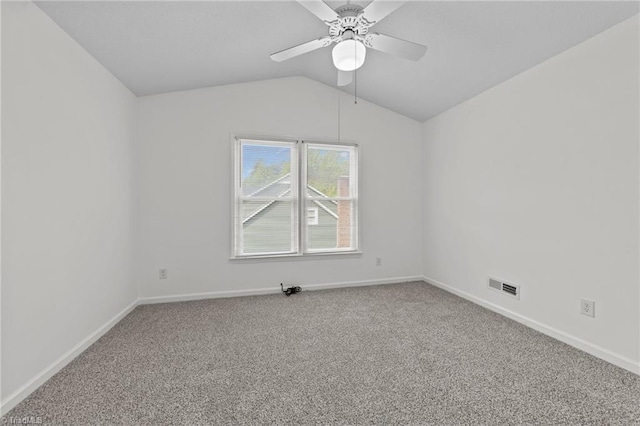 spare room with carpet, visible vents, and baseboards