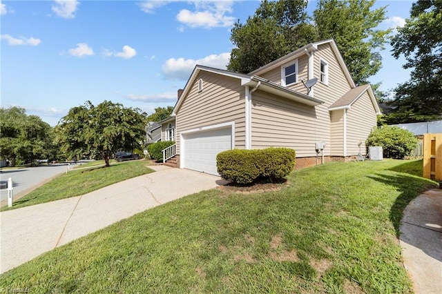 view of side of home featuring an attached garage, a lawn, and concrete driveway