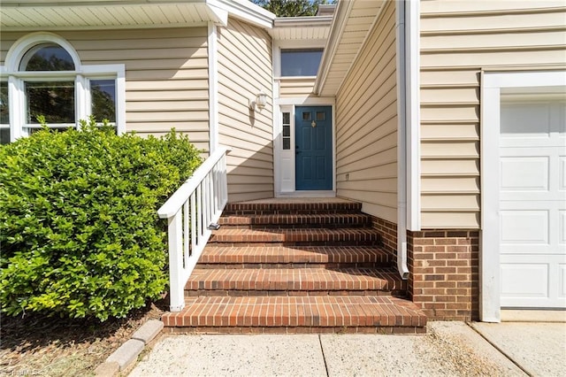 property entrance with an attached garage