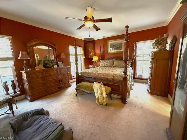 bedroom with light colored carpet, crown molding, and ceiling fan