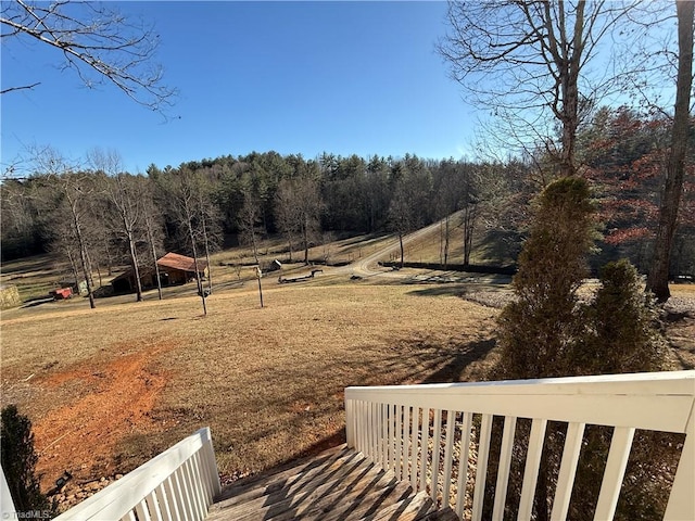 view of yard with a view of trees