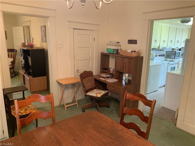 home office with washer / clothes dryer, a chandelier, and light colored carpet