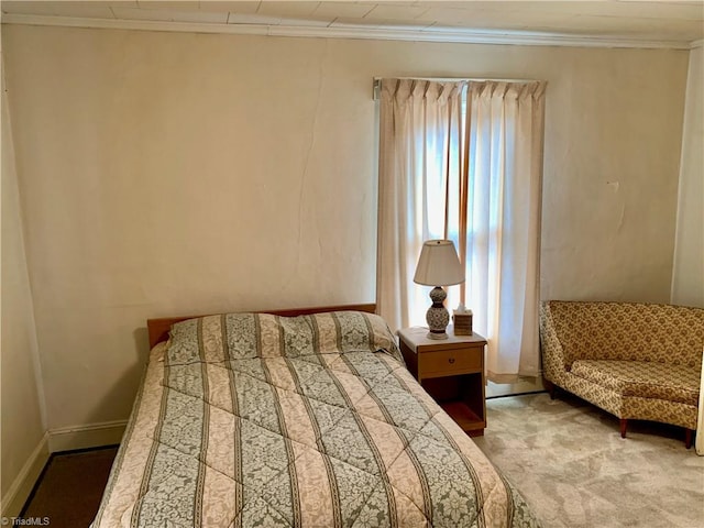 bedroom featuring multiple windows, carpet floors, and ornamental molding