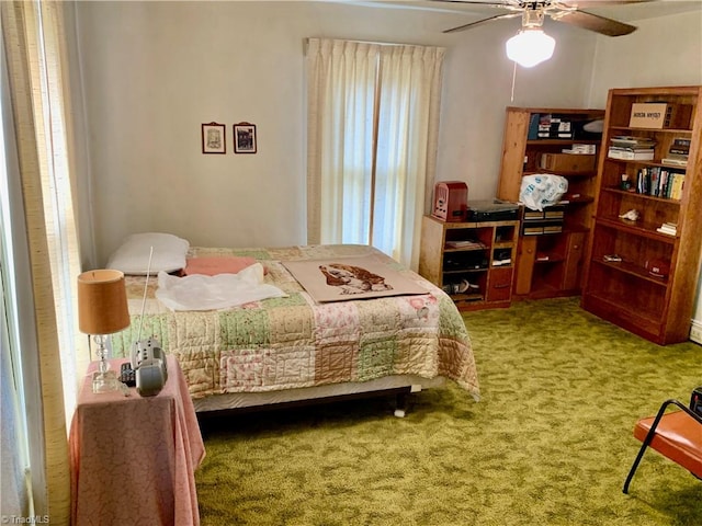 bedroom featuring ceiling fan and carpet floors