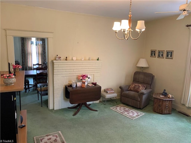 living area featuring carpet floors and a notable chandelier