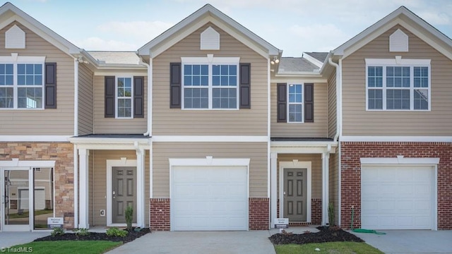 townhome / multi-family property featuring a garage