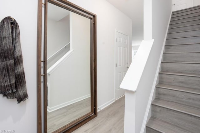 stairway featuring wood-type flooring