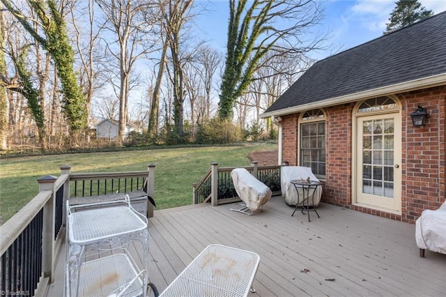 wooden terrace with a lawn