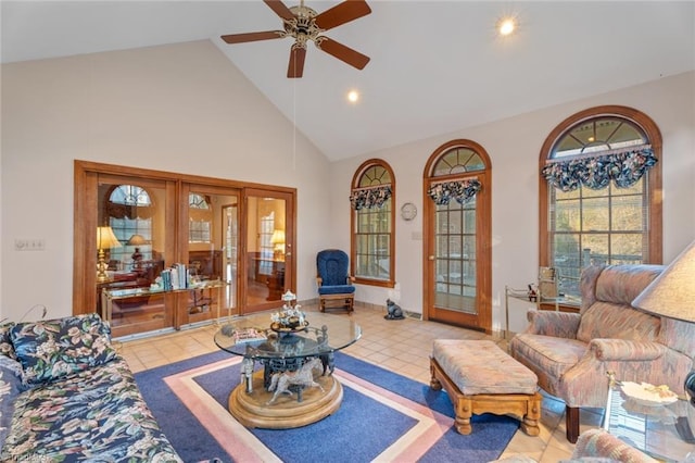 tiled living area featuring high vaulted ceiling, french doors, and ceiling fan