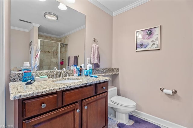 bathroom with toilet, vanity, baseboards, ornamental molding, and a shower stall