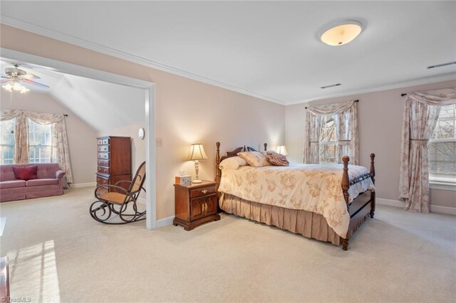 bedroom with light colored carpet, crown molding, and baseboards