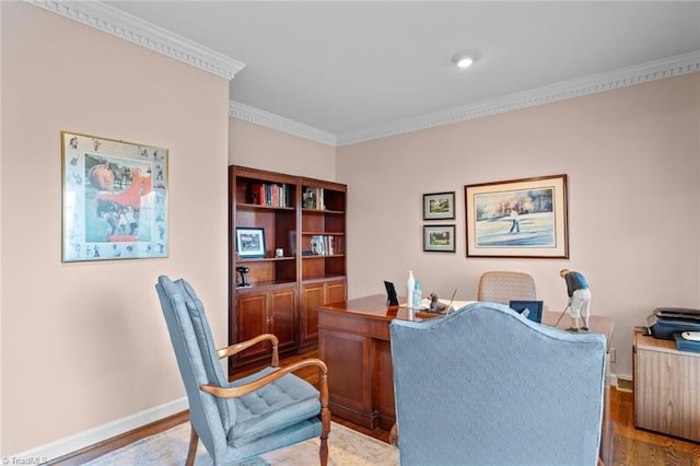 office space with ornamental molding, wood finished floors, and baseboards