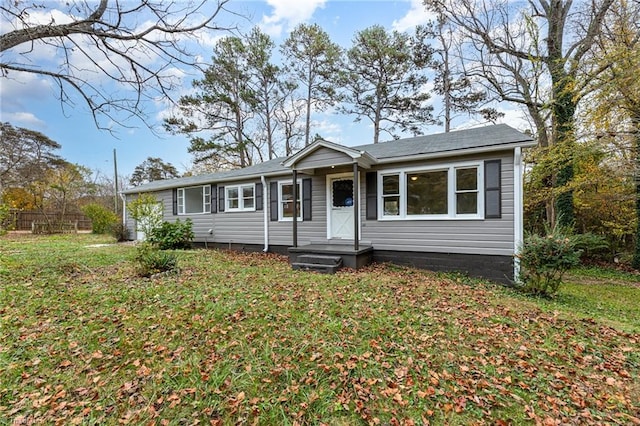 single story home featuring a front lawn