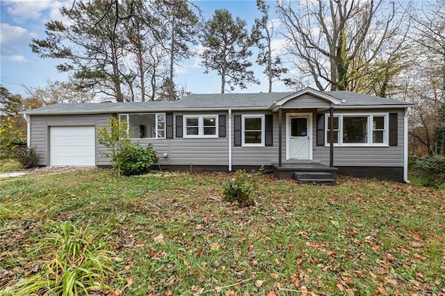 single story home with a front lawn and a garage